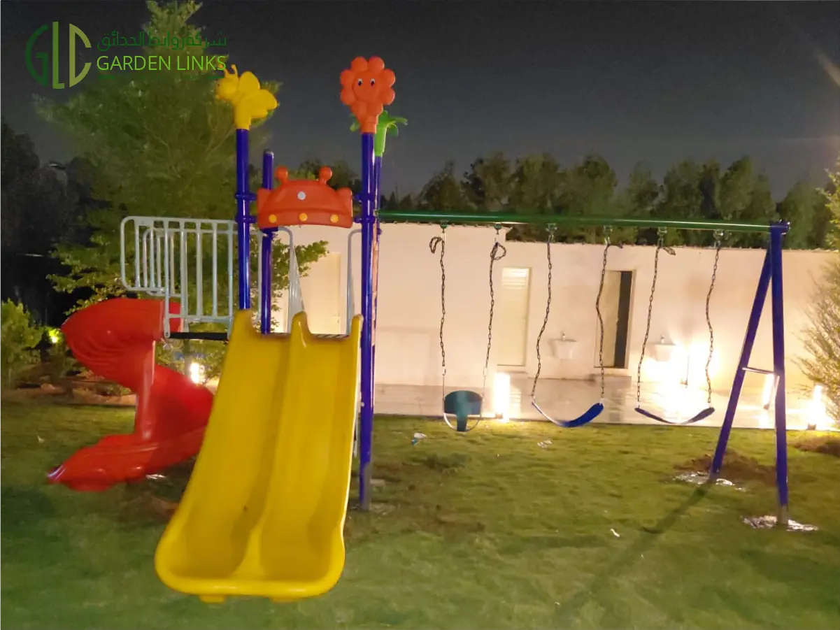 Outdoor Playground Installation in Al Haeer Riyadh with slides, swings, monkey bars, and round play equipment by Garden Links Company.