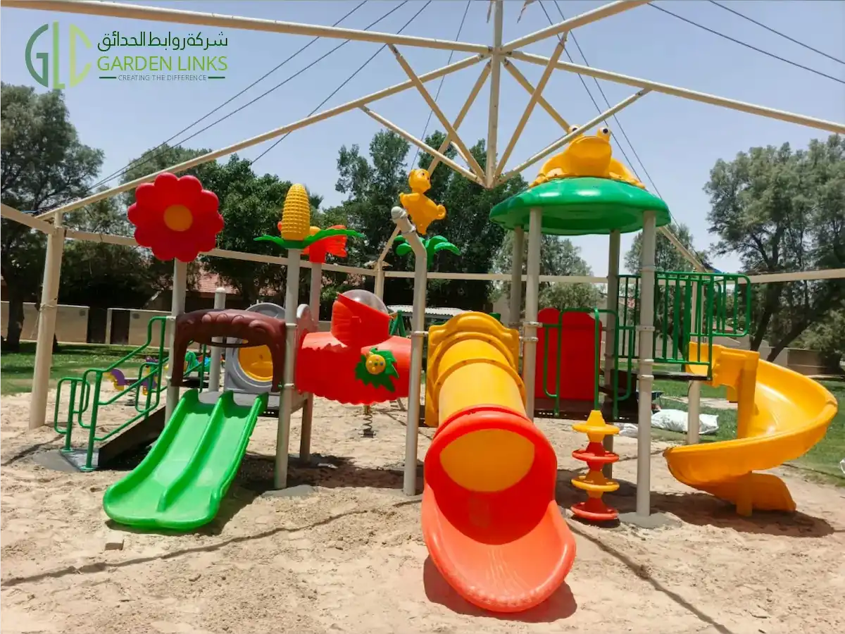 Multi-play outdoor playground equipment installed in Jeddah with tube slide, spiral slide, double slide, stairs, shade structure, and themed play panels