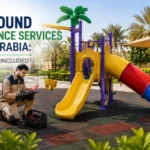Playground maintenance technician inspecting a complete outdoor play area with swings, slides, climbing equipment, rubber flooring, and greenery in Saudi Arabia