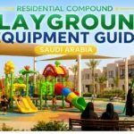 Green playground equipment with slides, swings, shade, seating, and families inside a modern Saudi residential compound.