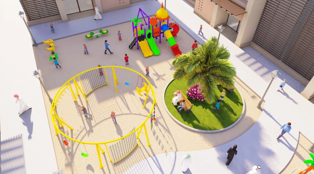 Aerial view of a Saudi school playground with play equipment, climbing area, pathways, seating, and landscaped rest space.