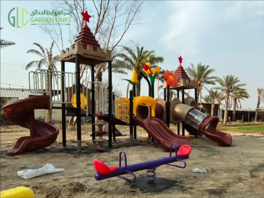 Commercial outdoor multi-play playground with spiral slide, tunnel slide, wave slide, and spring seesaw installed in Dammam, Saudi Arabia by Garden Links.