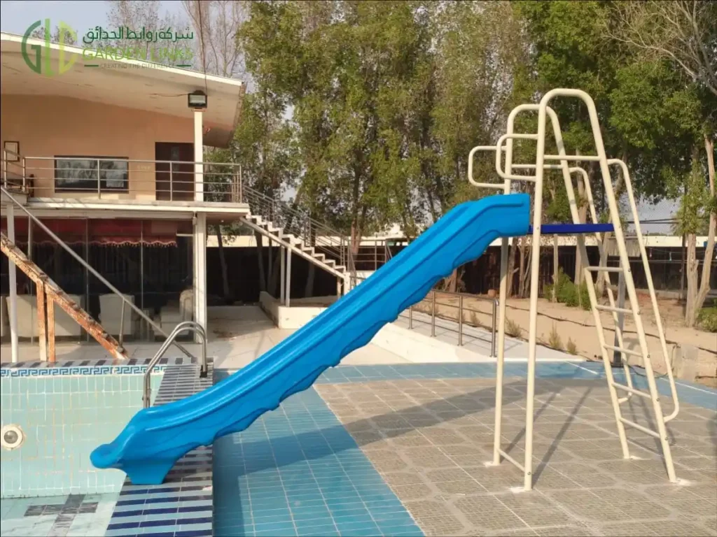 Commercial swimming pool slide installed in Dammam, Saudi Arabia, featuring a heavy-duty galvanized steel frame and durable blue slide by Garden Links.