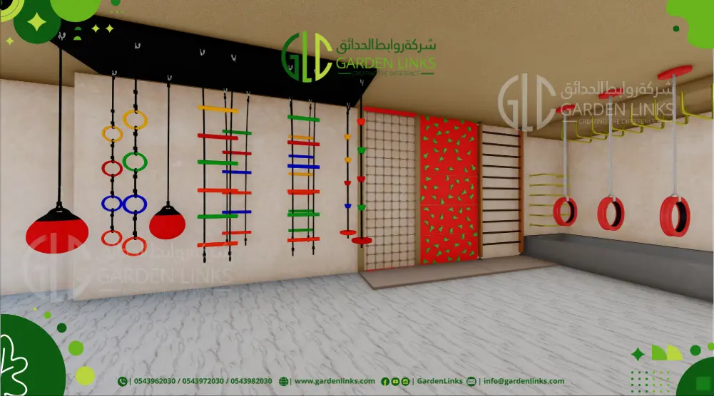 Indoor climbing wall with hanging rings, rope ladders, climbing nets, rock-climbing panels, tire obstacles and overhead bars