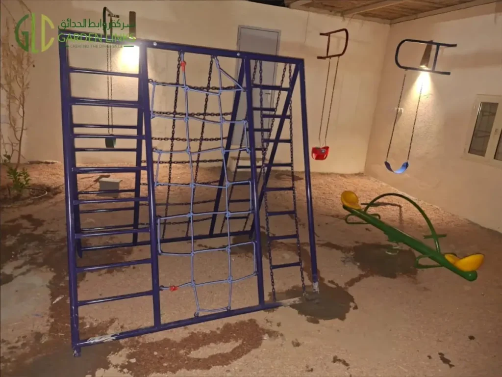 School playground installation in Najran with multi-activity climbing frame, rope climbing net, ladder elements, swing seats and children’s seesaw.