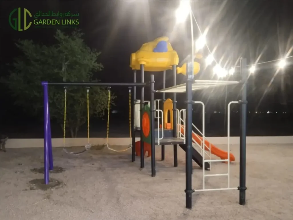 Home playground in Hati, Saudi Arabia featuring slides, climbing bars, elevated platforms and children’s swings.