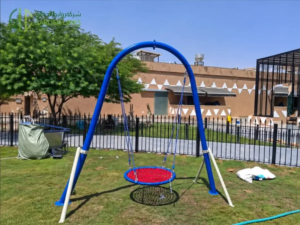 Basket swing installed at a public park playground in Al Khuzama, Al Kharj, Saudi Arabia.