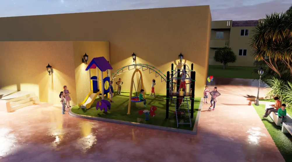 Wide evening view of compact playground with swings, climbing equipment and artificial grass