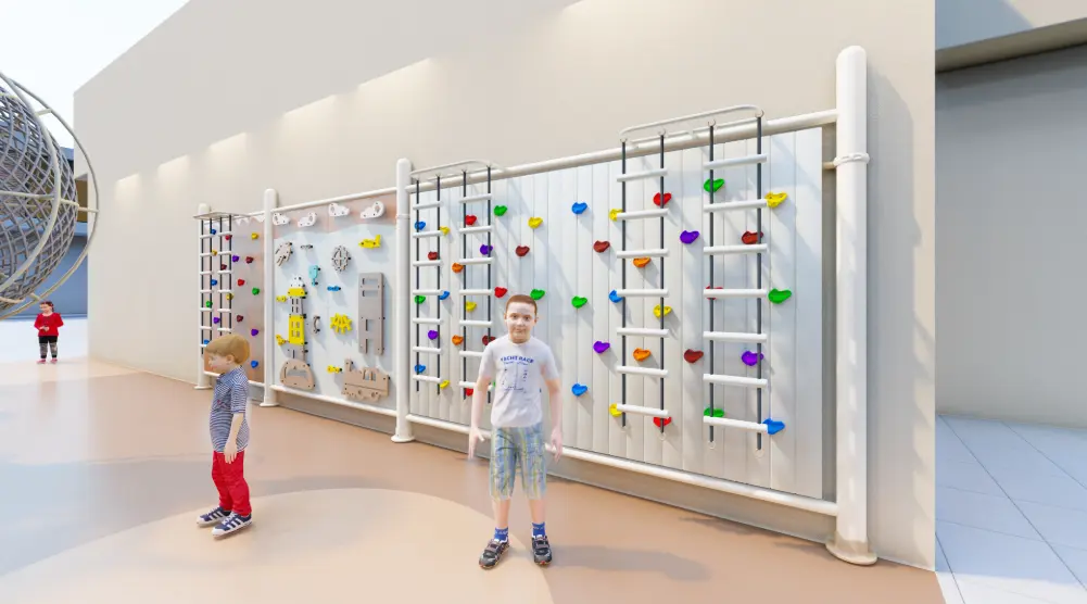 Boy standing beside colorful climbing walls in a 14 × 8 m outdoor adventure playground