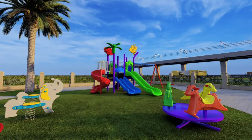 Wide view of landscaped playground with play tower, carousel and animal spring riders