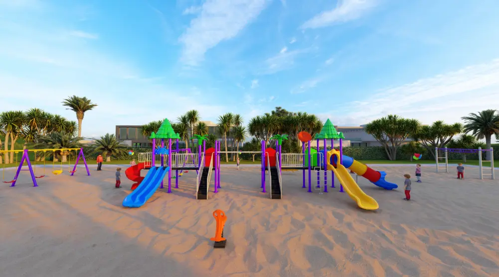 Front view of connected playground towers with green roofs, blue and yellow slides and purple posts
