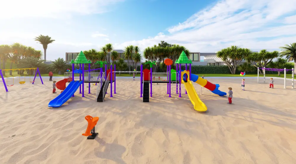 Close front view of playground towers with blue and yellow slides and an orange spring rider
