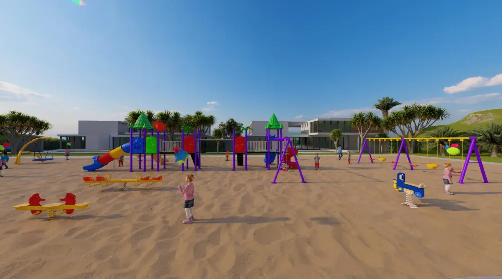 Wide side view of an outdoor playground with seesaws, spring riders, swings and green-roofed towers