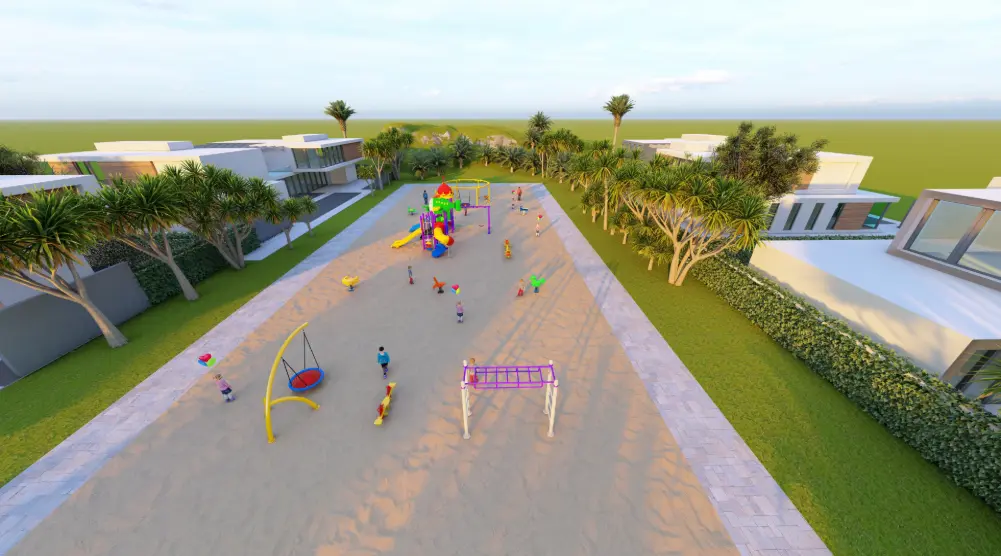 Lengthwise aerial view of a rectangular playground with themed towers, climbing bars and swings