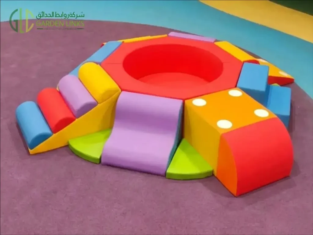 Colourful circular soft-play set with padded steps, ramps and curved shapes at Beech Hall School Riyadh.