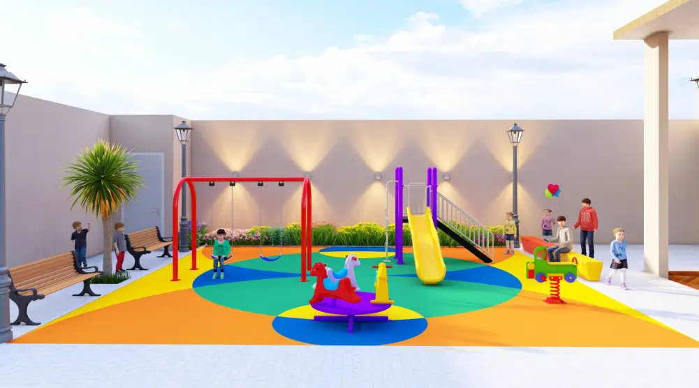 Colorful roundabout in front of a red swing frame and yellow slide within a small courtyard playground