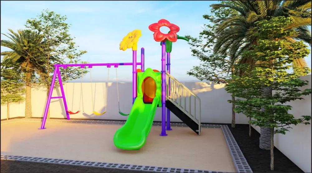 Ground-level view of a green slide beneath red and yellow flower decorations with swings and a staircase alongside