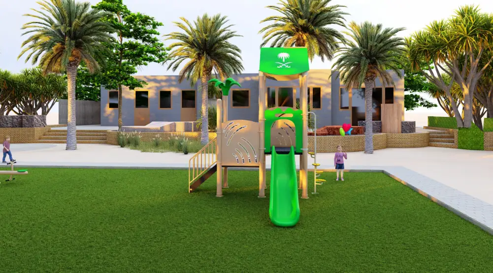 Front view of a small play tower with a green roof and straight slide in a palm-lined garden