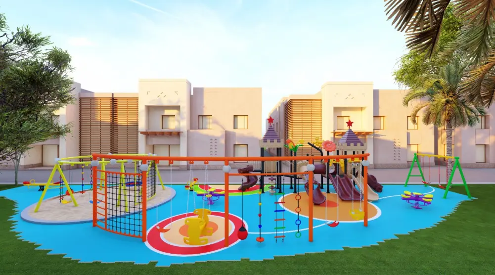 Front view of an orange rope climbing frame with castle slides, swings and colourful blue surfacing behind it