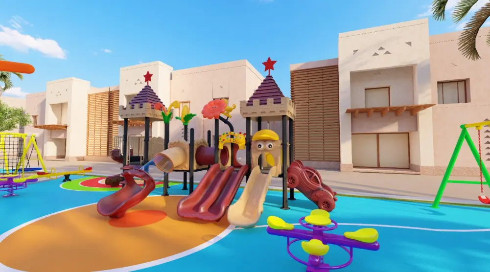 Castle-style play towers with red and beige slides beside a purple and yellow spring seesaw